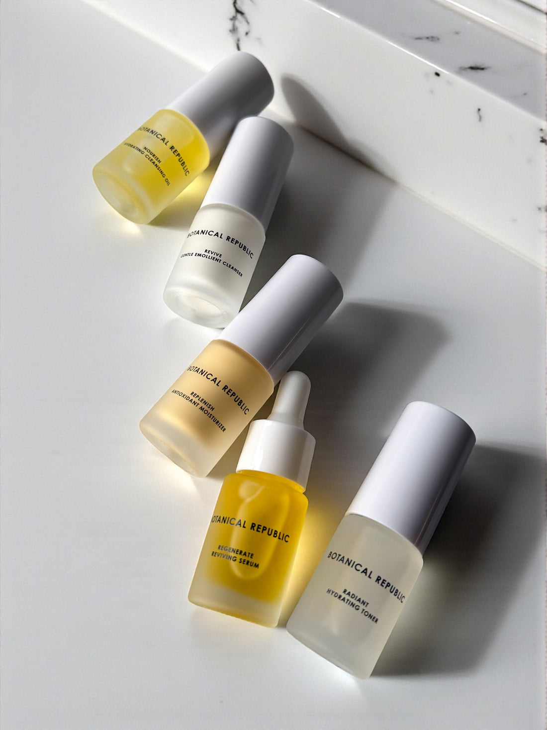 Set of skincare products from Botanical Republic on a light surface
